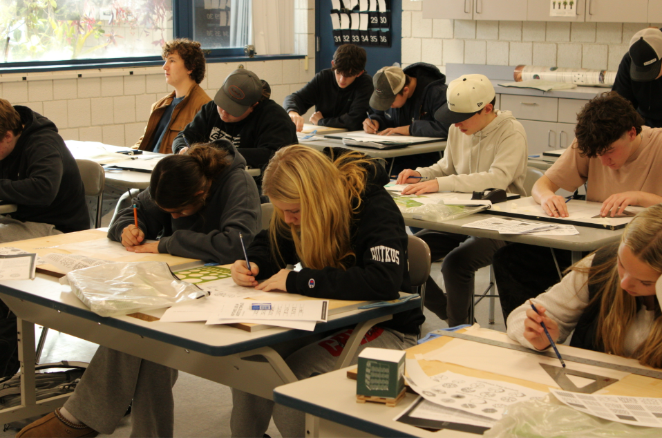Joseph LaFlamme’s sophomore landscaping class working on projects indoors. With so much snow on the ground, LaFlamme works to create assignments to help his class stay on track with the curriculum but still learning about landscaping. 