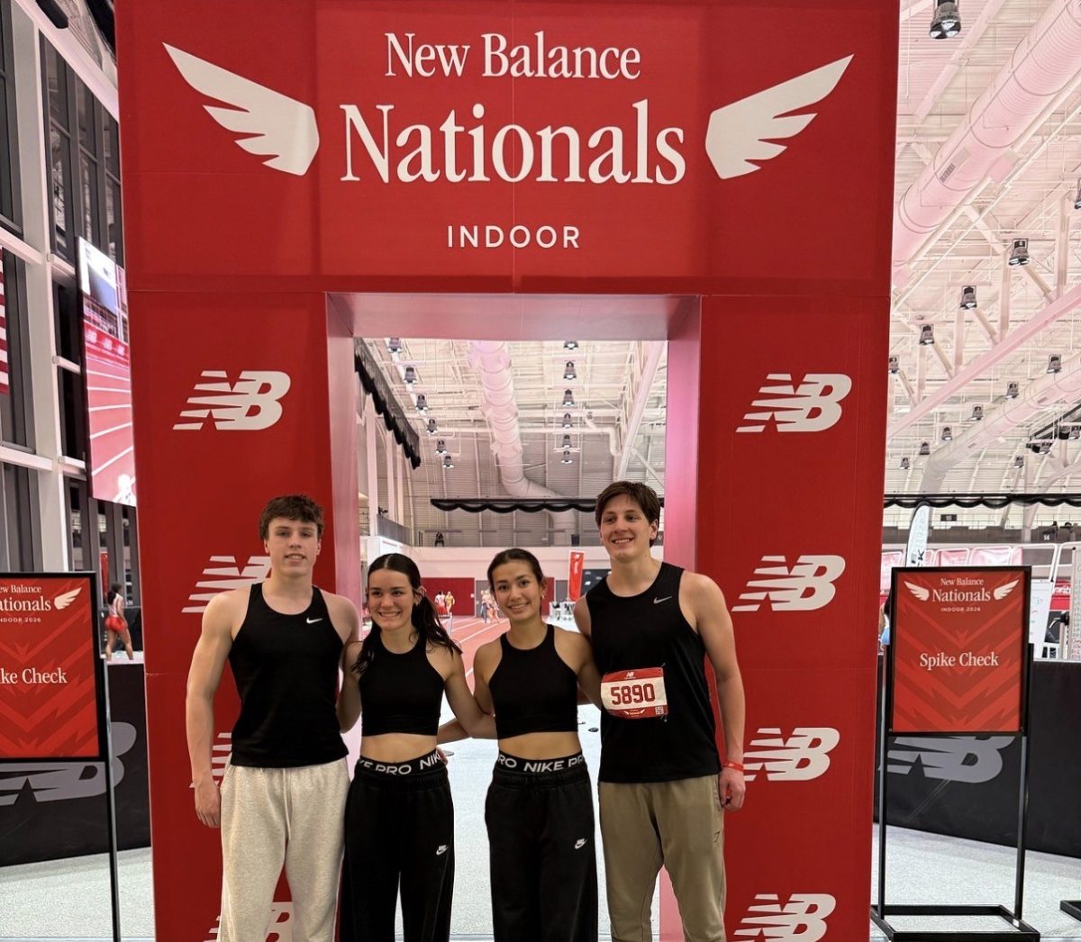 From left, senior Jake Cenatiempo, sophomore Maddie Gargulio, senior Sophia Gargulio and junior Luke Lodice pose for a picture after competing for nationals at the New Balance Track in Boston, Massachusetts. This spring's track teams will work together as both boys and girls track will hold joint practices and events. (Photo Credit - Louis Gargulio)