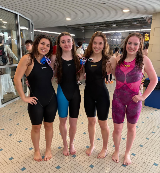 (from left) Catherine Viveros, Emily Stewart, Grace Rubacha and Aubrey Waldron pose at states on March 9th in West Hartford. The girls have been working throughout the season to break the 400 Free Relay with a 4:04:62 time. 
(Courtesy of Catherine Viveros)