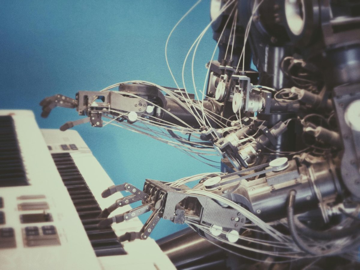 AI music is taking over and creating music based on songs it has already heard. Streaming apps like Spotify and Apple Music have a small percentage of their music made by AI, according to Music Ally. (Photo Credit - Unsplash - Possessed Photography) 