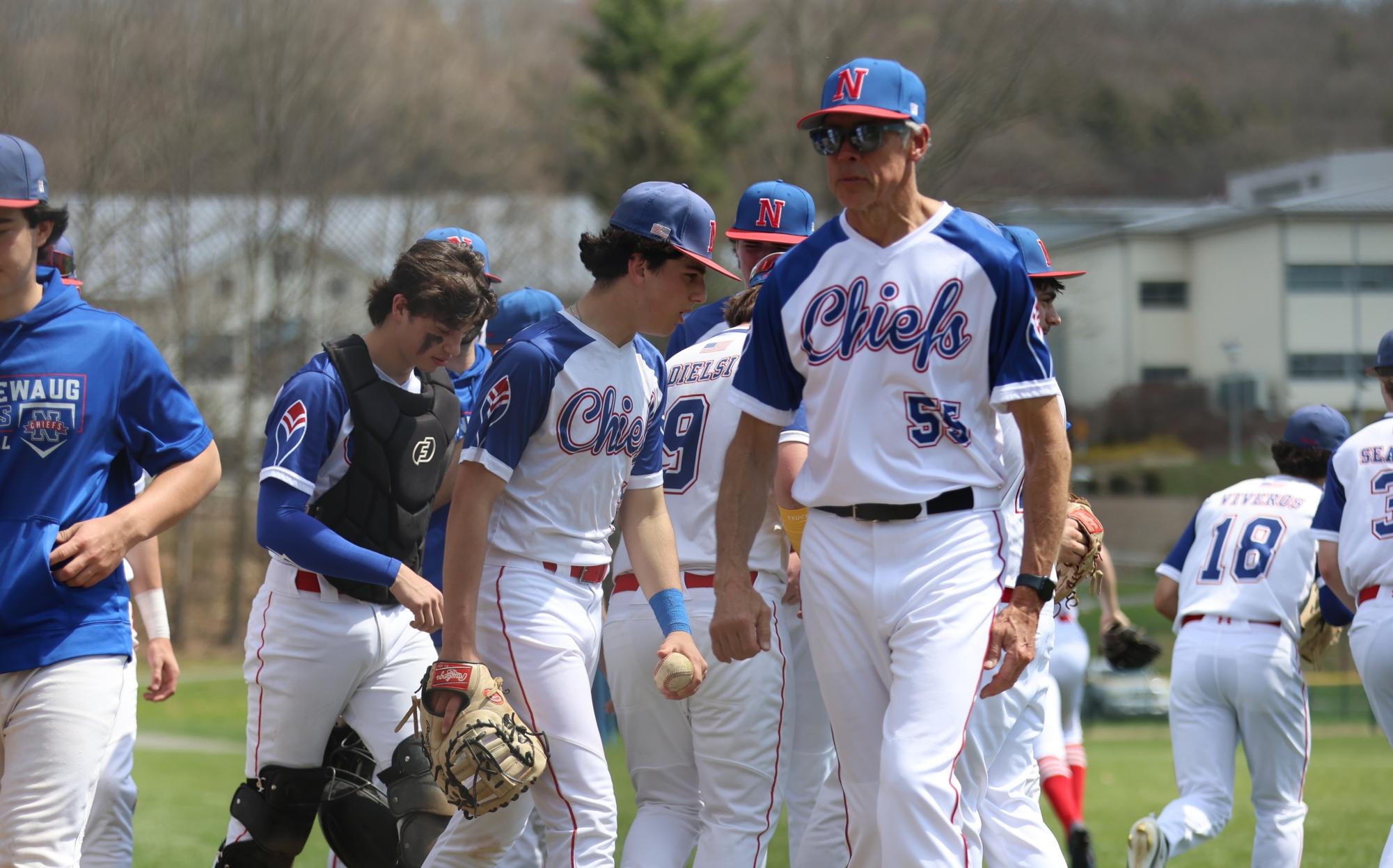 Coach Don Maki (right) exits the pre-game huddle on April 14th against Fairfield. Maki is already playing a key role in the baseball season so far. (Photo Credit - Noreen Chung)