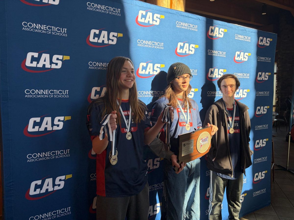 Members of the Nonnewaug Esports team, left to right Flynn Amodio, Cassidy Weeks, and Jack Butterly, proudly display their silver medals and plaque after winning second place in the Super Smash Bros state championship. NHS Esports will be competing for another championship on April 30th. (Photo Courtesy of Katie Blake)