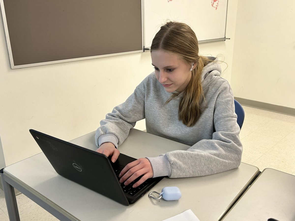 Freshman Hope Davis listens to music while working on her computer. 