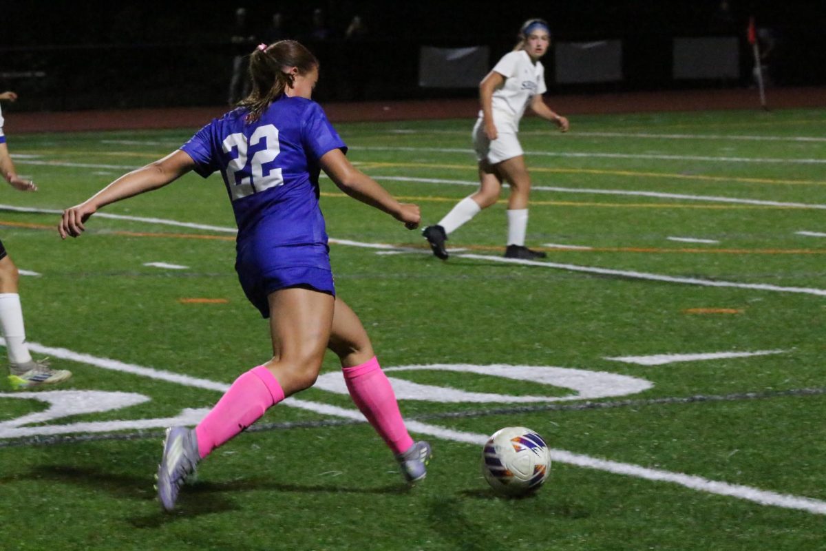 Sophomore Rosie Makarewicz passes the ball up their field in the annual Nonnewauf Homecoming game against Shepaug. Makarewicz showcases her number and the deeper meaning of it to her.