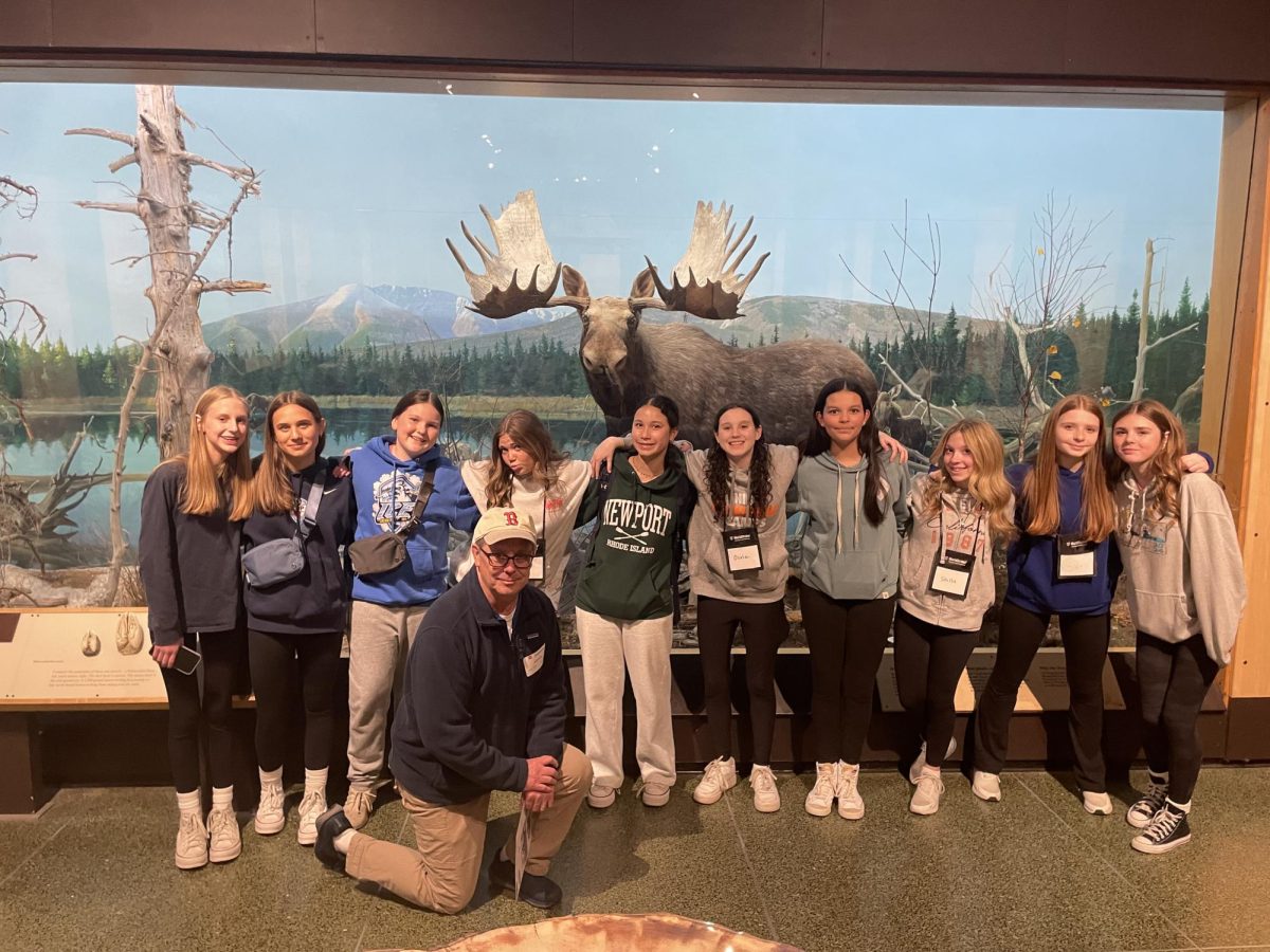 From left to right, Hope Davis, Sam Savulak, Delani Packett, Linneah Brennan, Jim Spinner, Charlotte Toon, Olivia Penrosa, Cora Grogean, Stella Stein, Gwen Murphy, Lilly Rich) stand in the museum they visited during their Boston field trip in spring of 2025; these eighth graders were the first class to visit Boston for Woodbury Middle School.  
