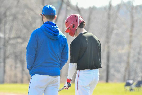 Scott Viveros stands with head coach Kyle Tehan on March 27 in a game against Pompuraug. The Chiefs dominated the competition in the BL and challenged themselves against high-level out-of-league competition all in an effort to prepare for next week's state tournament. 
