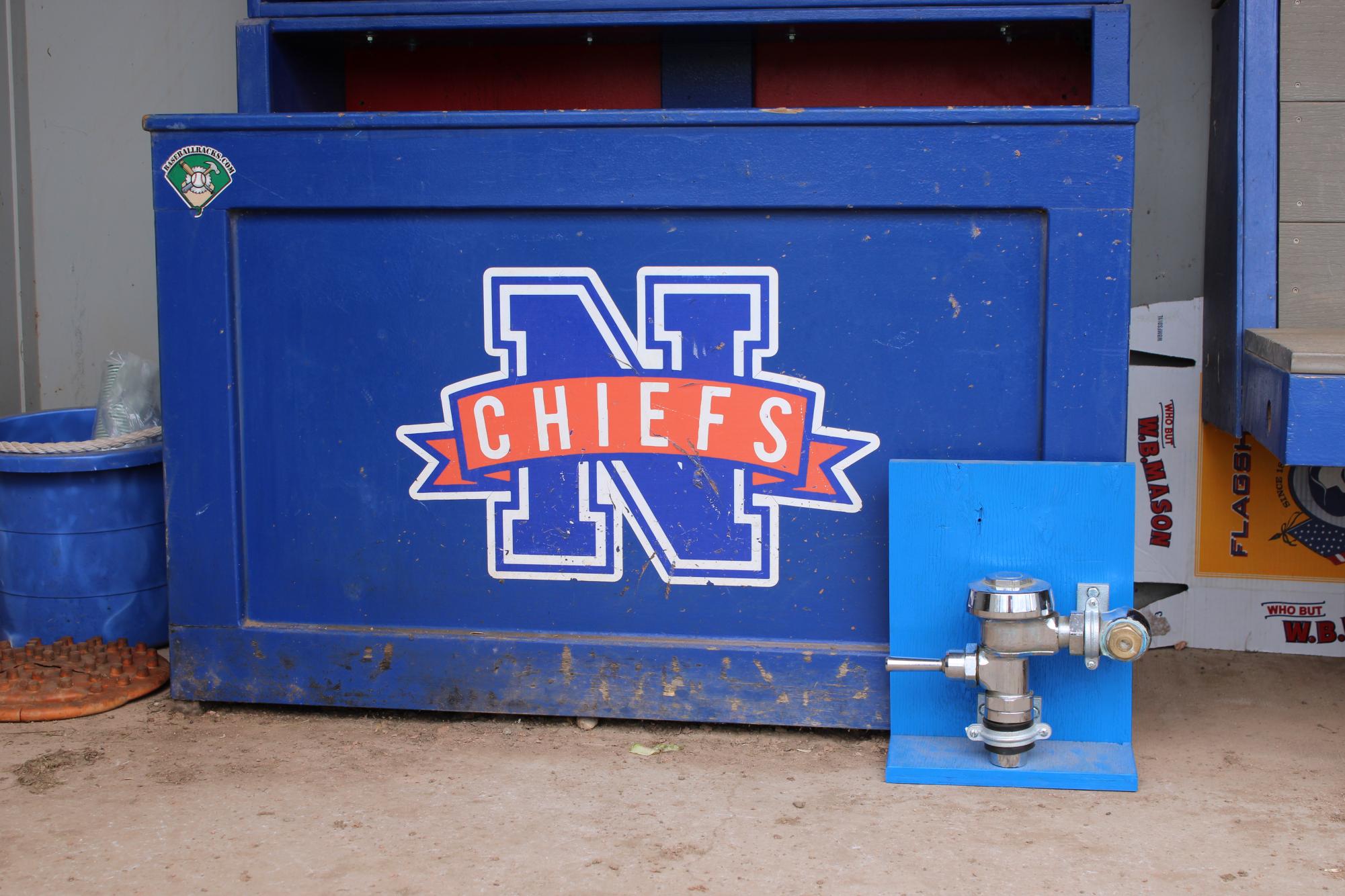 Nonnewaug Baseball's toilet handle sits in their dugout during home games. The toilet handle is a symbol of their saying "flush it" which they use to cover come mental challenges. 