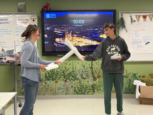 Freshmen Harriette Bayliss and Carter Ivey act out a scene using makeshift swords in Mrs. Gambardella’s 5th period class. Many students comment, that even though they had to step out of their comfort zones, they have fun acting in class. 
