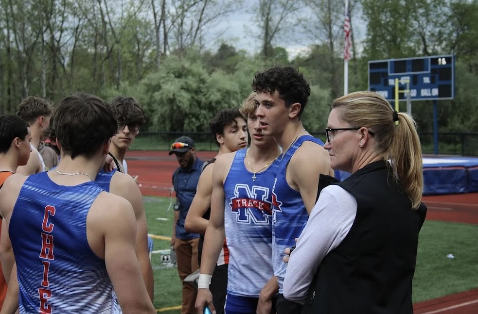 Deb Flaherty prepares a few of her athletes before a home meet vs. Terryville on May 8th, 2025. Flaherty is very close with all of her athletes and students, forming bonds that contribute to even more success on the track, on the course, and in the classroom. (Photo Credit: Instagram/nonnewaug_xc_track_field)
