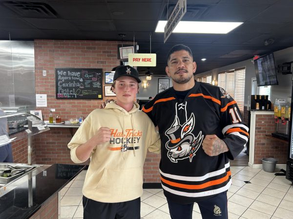 
Nonnewaug junior Max Sorcher [left]  gifts Alex Pereira a Danbury Hat Tricks jersey. Pereira will be fighting Cyril Gane in the white house on June 14th.
